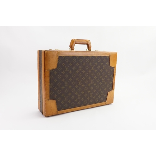 601 - A Louis Vuitton style brief case. Given to the vendor in the 1990s.