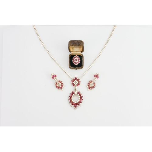 246 - An incredible 18ct diamond and ruby three-piece jewellery suite, consisting of 238 diamonds & 90 cab... 