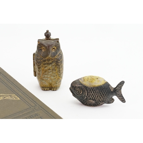 602 - A Animal Life of the British Isles pocket guide, along with a fish pin holder and owl.