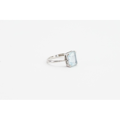 253 - A 9ct white gold emerald cut aquamarine ring. Size M. Aquamarine size approx 7.8mm x 9.8mm. Weight 2... 