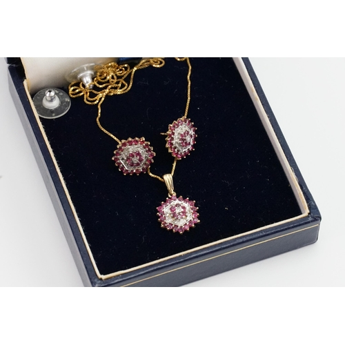 249 - A 9ct diamond & ruby set necklace and earrings. Weight 4.1g