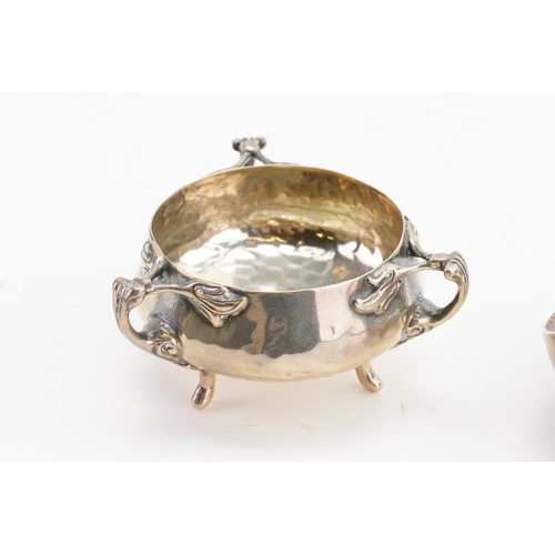 112 - A silver hand beaten condiment pot, along with a silver plated christofle leaf pot.