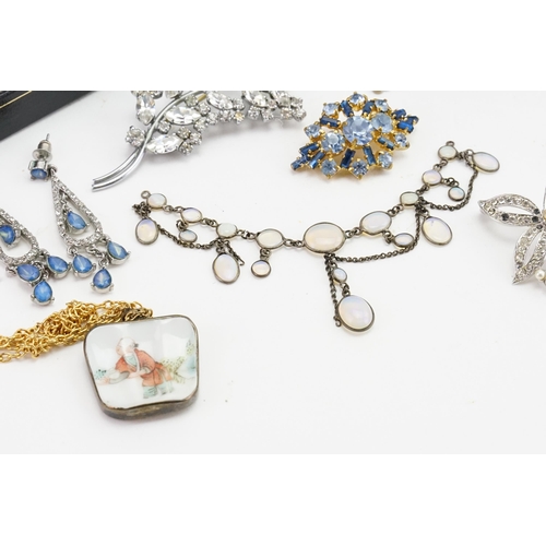 297 - A collection of costume jewellery, to include a moonstone necklace, items of 'amber', brooches, porc... 