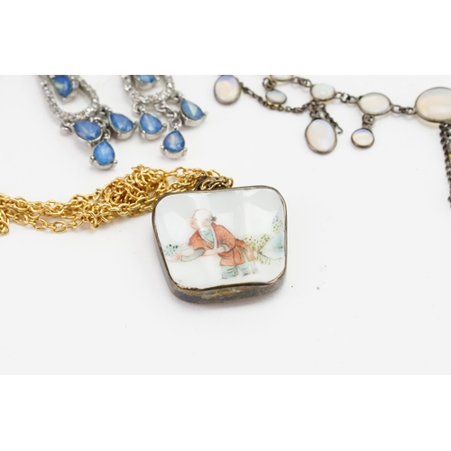 297 - A collection of costume jewellery, to include a moonstone necklace, items of 'amber', brooches, porc... 