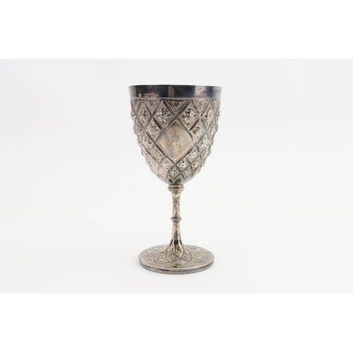 115 - A silver embossed chalice. Weight 100g.