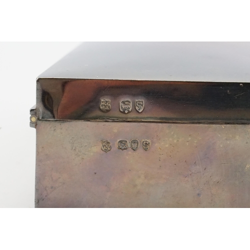 119 - A silver 1893 cigar box. Decorated with a stag head crest. Size 20cm x 8.5cm x 4.5cm.