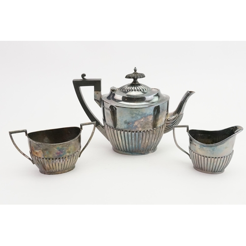 120 - A 1929 Walker & Hall silver tea set, to include cream and sugar. Weight 731g.