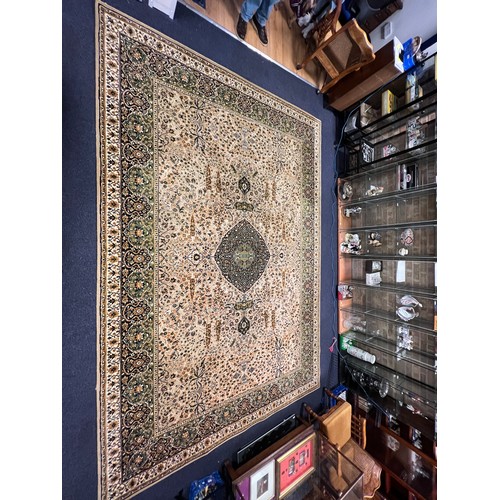 577 - A Beige, Brown & Black Floral edged Wilton Rug with decorative Gulls & Floral Pattern. Measuring: 13... 