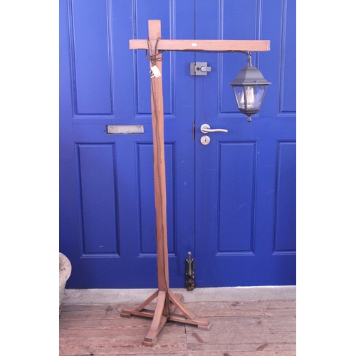 510 - An Arts & Crafts Oak Reading Lamp fitted with a Metal Lantern Shade in the Gallows Style.