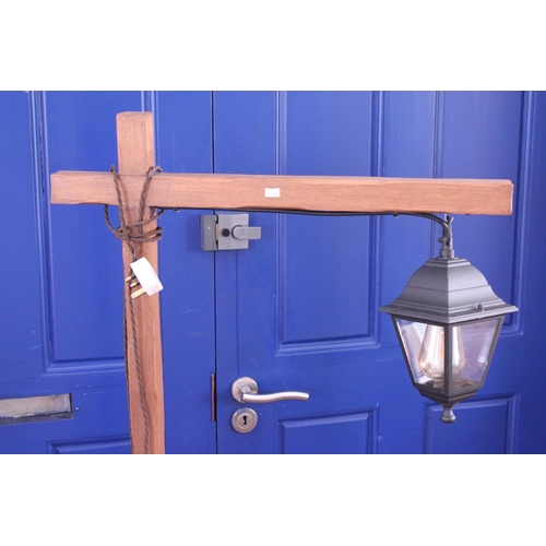 510 - An Arts & Crafts Oak Reading Lamp fitted with a Metal Lantern Shade in the Gallows Style.