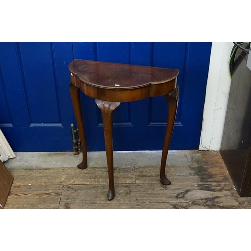 529 - A Cuban Mahogany Veneered & Cross Banded Shaped Topped Lamp Table resting on Pad Feet. Measuring: 59... 