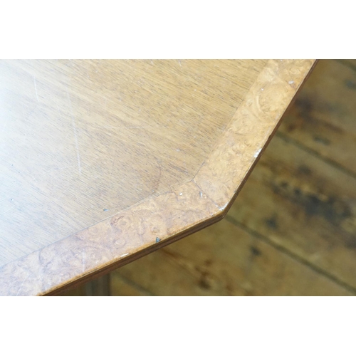 533 - A Regency designed Walnut banded Extending Dining Table resting on swept out brass covered feet & Ca... 