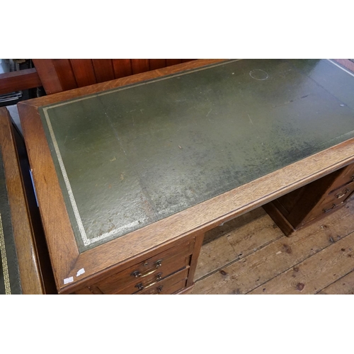 558 - A 1920s Panel Sided Oak Office Desk fitted with Drawers & a Gilt Leather Top. Measuring: 80cms deep ... 