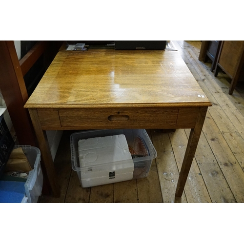 560 - A 1950s Oak Single Drawer Map Table resting on Square Legs. Measuring: 92cms x 76cms x 77cms High.