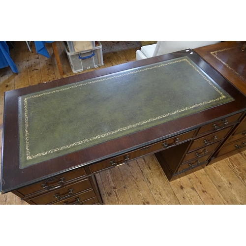 561 - A Reproduction Mahogany Pedestal Desk with with Drawers. Measuring: 121cms across x 60cms deep x 76c... 