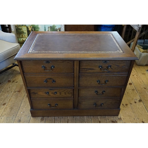 570 - An Oak effect Four Drawers Filing Cabinet. Measuring: 97cms across x 60cms deep x 73cms high. (This ... 