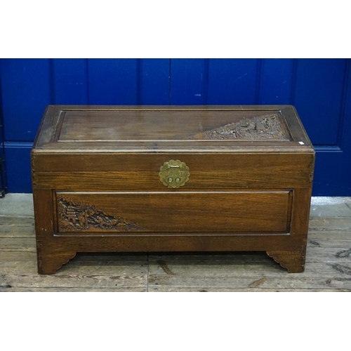 572 - A Chinese Hardwood Carved Top Coffer decorated with pagodas. Measuring: 90cms across x 40cms deep x ... 