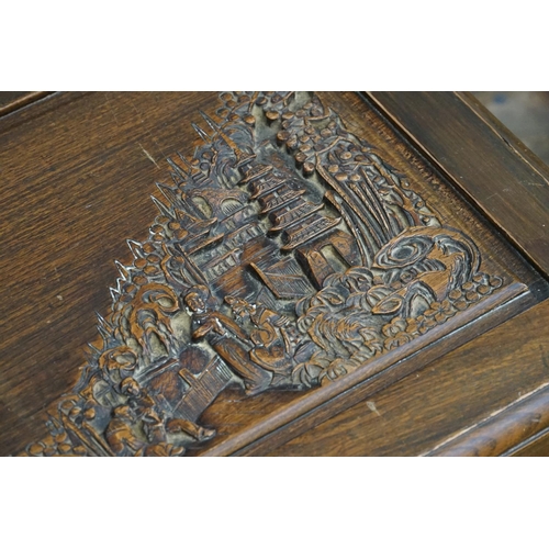 572 - A Chinese Hardwood Carved Top Coffer decorated with pagodas. Measuring: 90cms across x 40cms deep x ... 