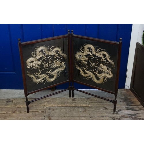 574 - An Aesthetic Period Two Fold Fire Screen with inset panels of Dragons.