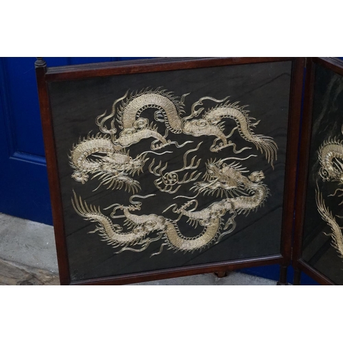 574 - An Aesthetic Period Two Fold Fire Screen with inset panels of Dragons.