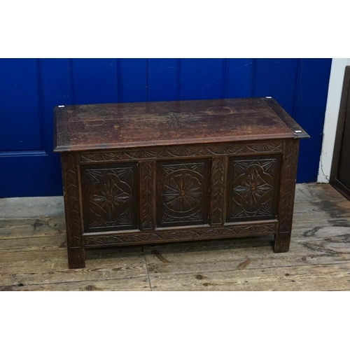 578 - A Reproduction Carved Fronted Stained Coffer. Measuring: 91cms across x 45cms deep x 52cms high.