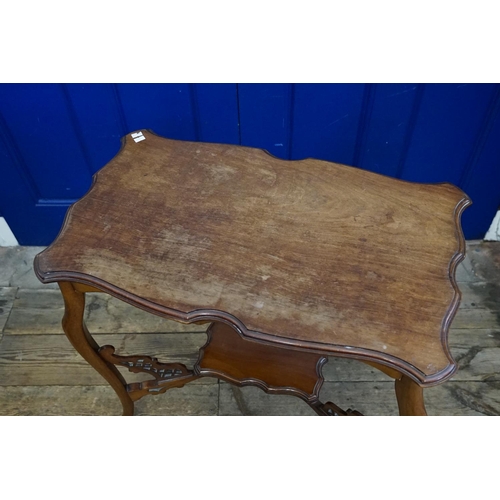 583 - A carved wooden side table with under tier made by 