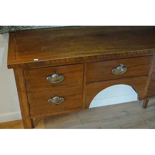 590 - A Regency Mahogany & Line inlaid Sideboard resting on square legs, fitted drawers & Cupboards, Shell... 