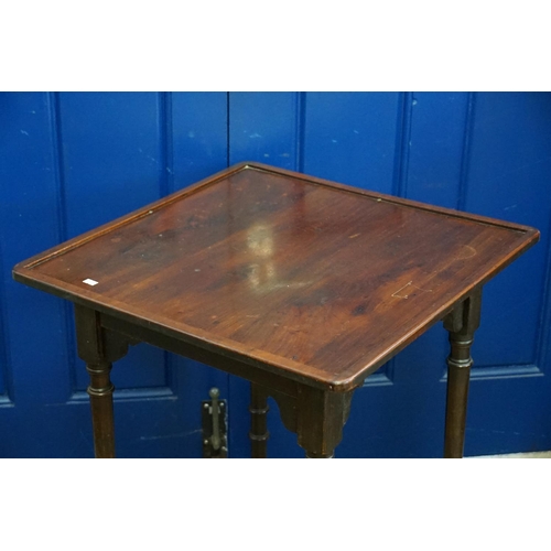 591 - A Late 19th Century Mahogany Aesthetic designed Card Table resting on turned legs. Measuring: 61cms ... 