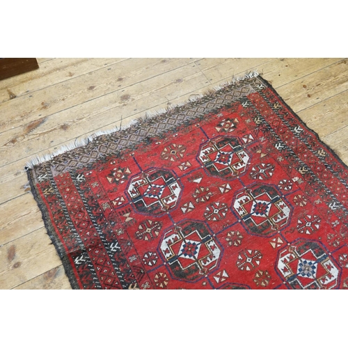 611 - A Red Ground Central Gold pattern & Medallion Rope Pattern Carpet. Measuring: 194cms x 117cms.