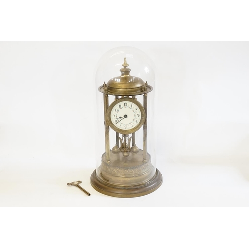 200 - A Brass Cased Anniversary Clock under Dome.