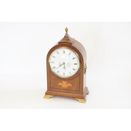 207 - A Cometti of London Georgian design Mahogany cased domed clock with brass fitting.