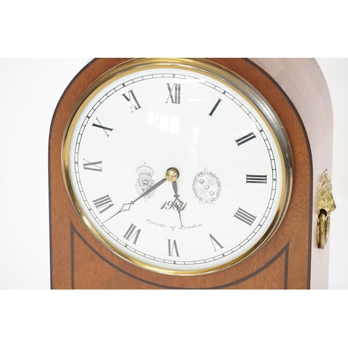 207 - A Cometti of London Georgian design Mahogany cased domed clock with brass fitting.