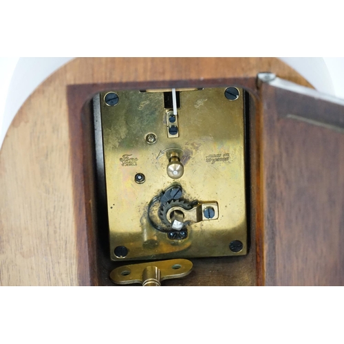 207 - A Cometti of London Georgian design Mahogany cased domed clock with brass fitting.