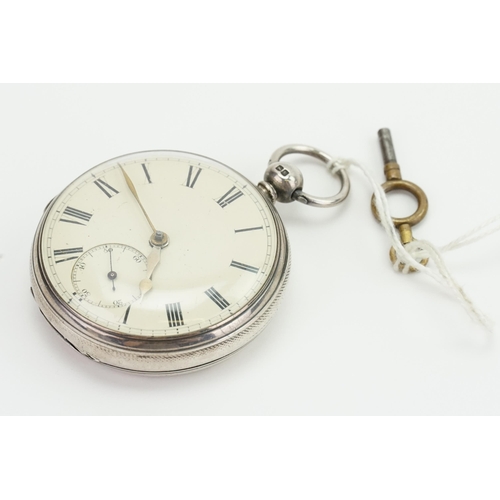 197 - A Silver sub second dial pocket watch with key.