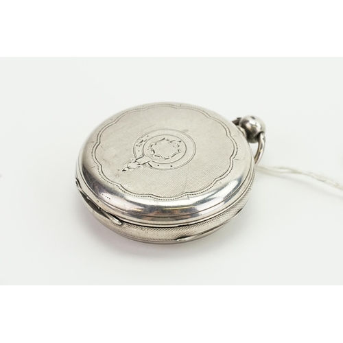 197 - A Silver sub second dial pocket watch with key.