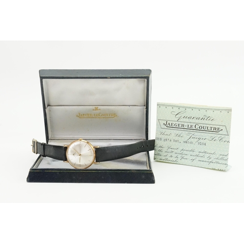 198 - A 1960's 9ct gold silver faced Jaeger-Le Coultre watch. Inscription on the back. Number 9194. Along ... 