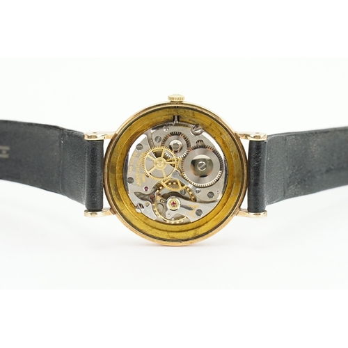 198 - A 1960's 9ct gold silver faced Jaeger-Le Coultre watch. Inscription on the back. Number 9194. Along ... 