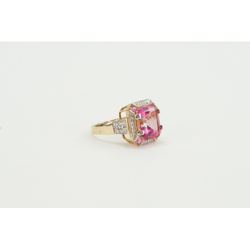 82 - A 14ct yellow gold diamond and pink topaz ring, set with five topaz stones, central topaz approx 10.... 