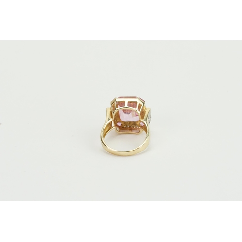 82 - A 14ct yellow gold diamond and pink topaz ring, set with five topaz stones, central topaz approx 10.... 