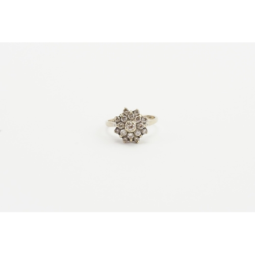 123 - A 18ct white gold diamond set ring, in the cluster form. Set with 17 diamonds, the largest 0.07ct. W... 