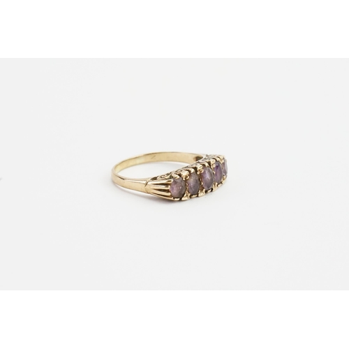 129 - A 9ct Gold Amethyst set ring, set with five Amethysts. Size U. Weight 3.7g.