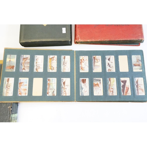 257 - A Collection of Cigarette Cards to include Cry's of London, Dogs, Flowers, Cars, Fish, Navy, Borough... 