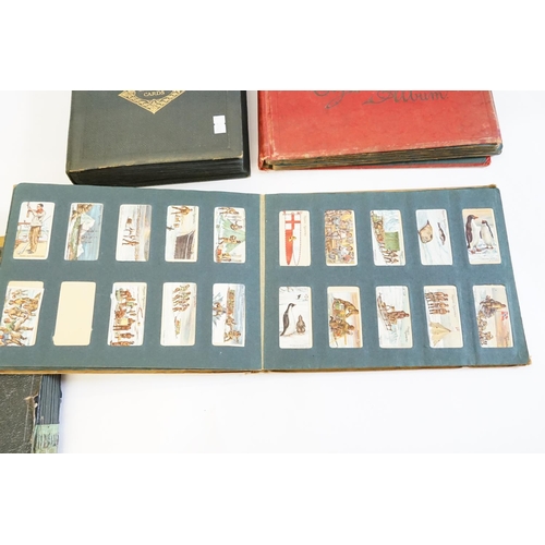 257 - A Collection of Cigarette Cards to include Cry's of London, Dogs, Flowers, Cars, Fish, Navy, Borough... 