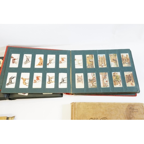 257 - A Collection of Cigarette Cards to include Cry's of London, Dogs, Flowers, Cars, Fish, Navy, Borough... 