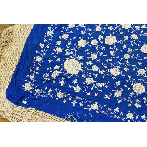 297 - A Chinese Electric Blue & embroidered Shawl with a long fringe.