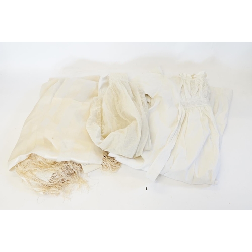 306 - A Child's lace embroidery anglaise Christening gown, (one other) and a fringed white linen shawl wit... 