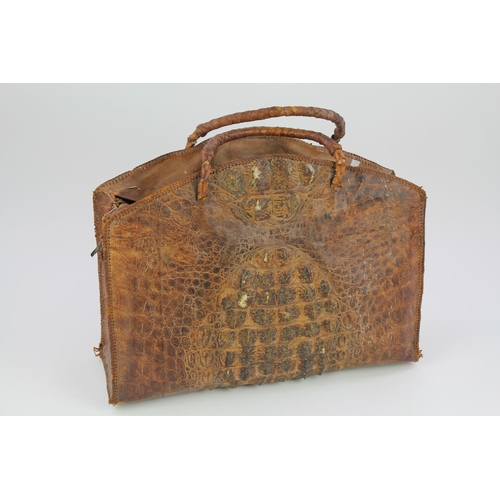 307 - A Native Work Crocodile Skin Handbag with Hand Woven Handles.