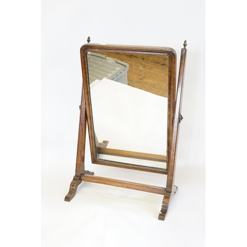 603 - A Swing Frame Dressing Table Mirror.