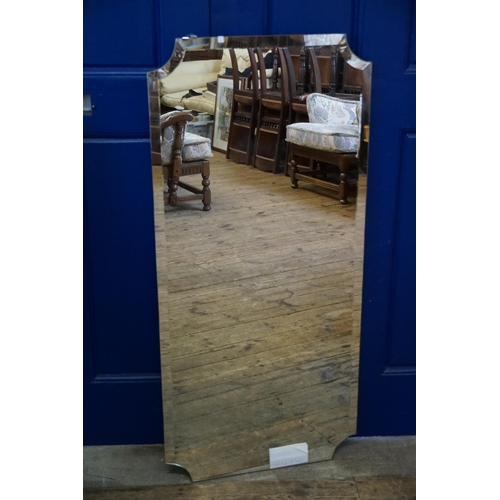 604 - A Frameless Cushion shaped Bathroom Mirror with fittings. Measuring: 112cms x 53cms.