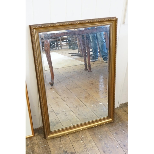 609 - A Gilt Framed Wall Mirror. Measuring: 49cms x 75cms.